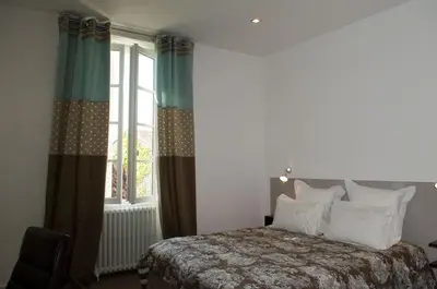 Un ou plusieurs lits dans un hébergement de l'établissement Chambres d'Hôtes Les Tilleuls