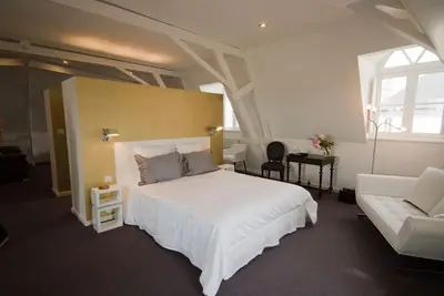 Un ou plusieurs lits dans un hébergement de l'établissement Chambres d'Hôtes Les Tilleuls