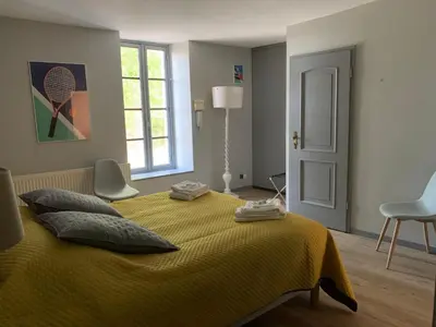 Un ou plusieurs lits dans un hébergement de l'établissement Cottage du Château l'Hubertière