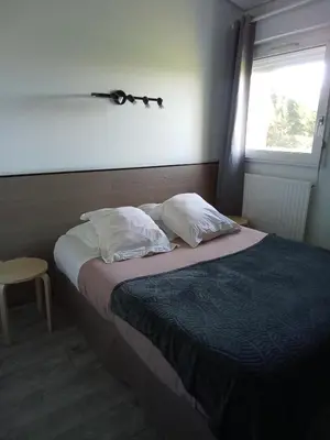 Un ou plusieurs lits dans un hébergement de l'établissement Hôtel Bon Repos
