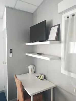 Télévision ou salle de divertissement dans l'établissement Hôtel Bon Repos