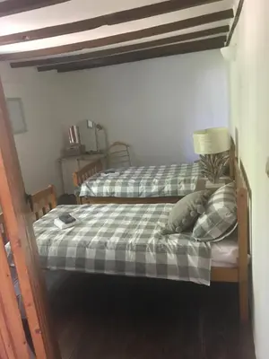 Un ou plusieurs lits dans un hébergement de l'établissement Maison L’allee