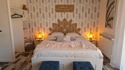Un ou plusieurs lits dans un hébergement de l'établissement chambre d'hotes studio des tourterelles