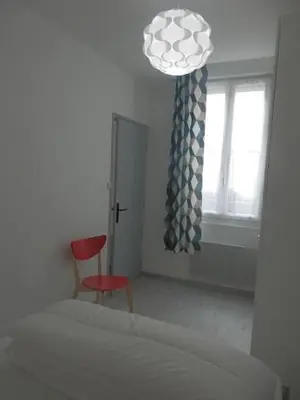 Un ou plusieurs lits dans un hébergement de l'établissement Appartement T2 ou T1 côté cour/jardin avec garage