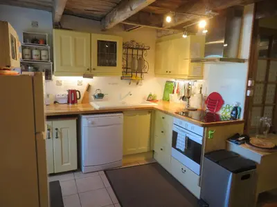Cuisine ou kitchenette dans l'établissement La Maison du Bonheur