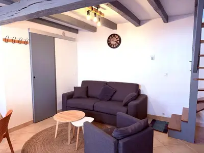 Coin salon dans l'établissement Petite maison tout confort