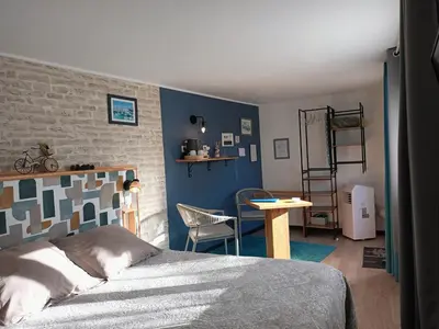 Un ou plusieurs lits dans un hébergement de l'établissement Le Clos des Passiflores - Chambres et Table d'Hôtes