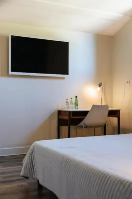 Un ou plusieurs lits dans un hébergement de l'établissement Villa-des-eaux Douces