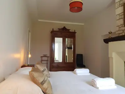 Un ou plusieurs lits dans un hébergement de l'établissement Domaine de Pelouaille - chambre d'hôtes