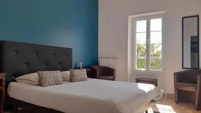 Un ou plusieurs lits dans un hébergement de l'établissement Domaine de Pelouaille - chambre d'hôtes