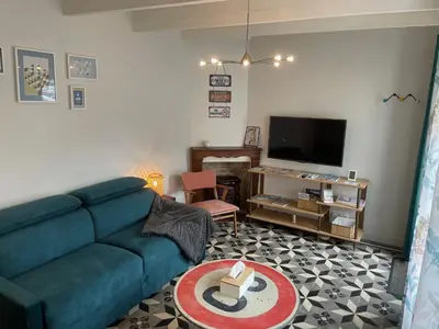 Télévision ou salle de divertissement dans l'établissement Place au Repos