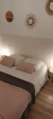Un ou plusieurs lits dans un hébergement de l'établissement Gîte le Hameau des Bordes 3 étoiles