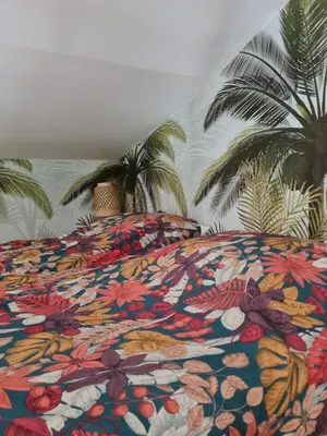 Un ou plusieurs lits dans un hébergement de l'établissement Gîte et Chambres d'Hôtes du Petit Moulin