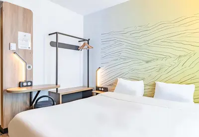 Un ou plusieurs lits dans un hébergement de l'établissement B&B HOTEL Poitiers Aéroport