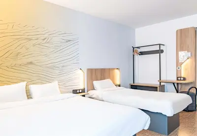 Un ou plusieurs lits dans un hébergement de l'établissement B&B HOTEL Poitiers Aéroport