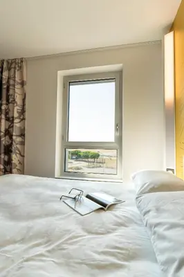 Un ou plusieurs lits dans un hébergement de l'établissement B&B HOTEL Poitiers Aéroport