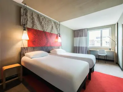Un ou plusieurs lits dans un hébergement de l'établissement Hôtel Ibis Cognac Centre