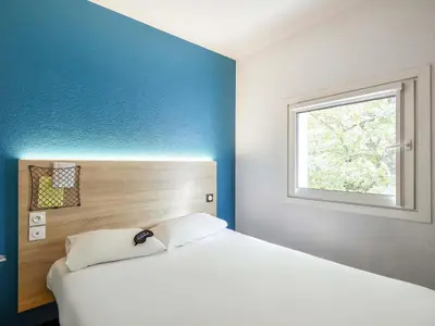 Un ou plusieurs lits dans un hébergement de l'établissement HôtelF1 Angoulême