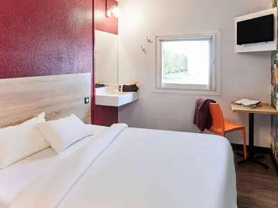 Un ou plusieurs lits dans un hébergement de l'établissement HôtelF1 Angoulême