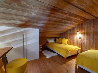 Un ou plusieurs lits dans un hébergement de l'établissement Chalet à Megève avec espace bien-être et animaux acceptés - FR-1-569-3