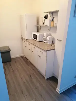 Cuisine ou kitchenette dans l'établissement Appartement meublé proche du futuroscope