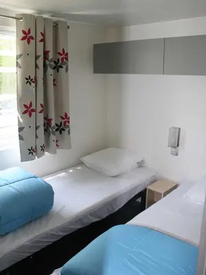 Un ou plusieurs lits dans un hébergement de l'établissement Camping l'île Cariot