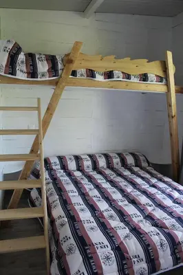 Un ou plusieurs lits dans un hébergement de l'établissement Camping belle rivière
