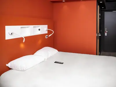 Un ou plusieurs lits dans un hébergement de l'établissement ibis Budget Cognac