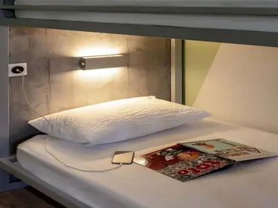 Un ou plusieurs lits dans un hébergement de l'établissement ibis Budget Cognac