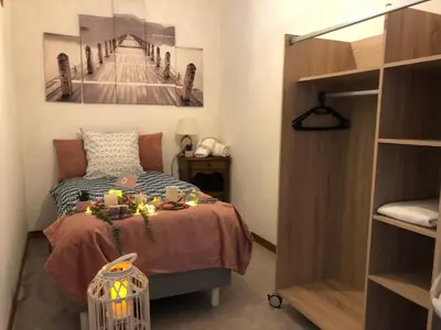 Un ou plusieurs lits dans un hébergement de l'établissement LES APPART's DES THERMES