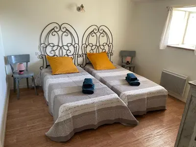 Un ou plusieurs lits dans un hébergement de l'établissement Gîte de charme avec terrasse et activités familiales à Payré, près de Fontenay-le-Comte - FR-1-426-170