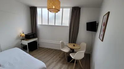 Un ou plusieurs lits dans un hébergement de l'établissement Le Relais du Valois, Cognac Centre