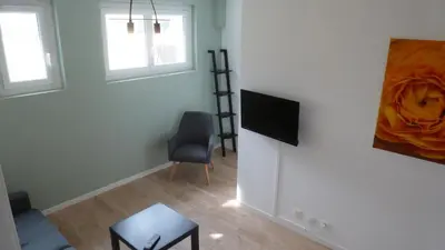 Télévision ou salle de divertissement dans l'établissement Logements Le232Fr Futuroscope Poitiers