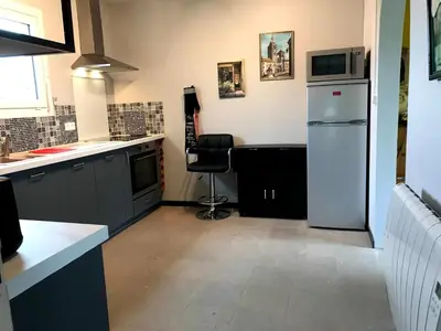 Cuisine ou kitchenette dans l'établissement Le Cottage
