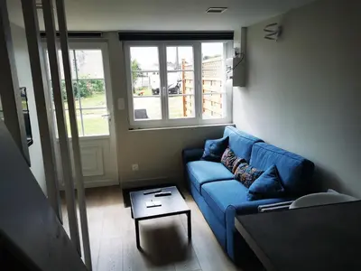 Coin salon dans l'établissement Logement entier à LA CRECHE