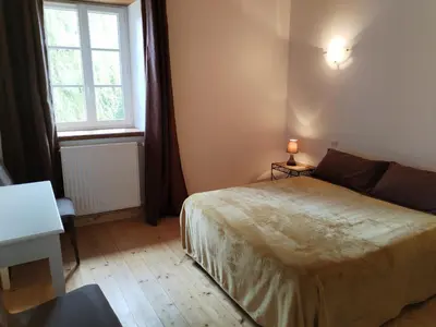 Un ou plusieurs lits dans un hébergement de l'établissement La Maison près du ruisseau