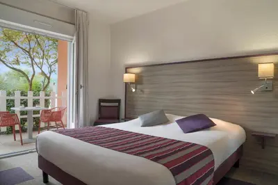 Un ou plusieurs lits dans un hébergement de l'établissement Contact Hôtel O'Nice Saintes