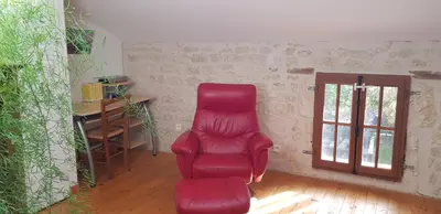 Coin salon dans l'établissement Charmante maison de campagne