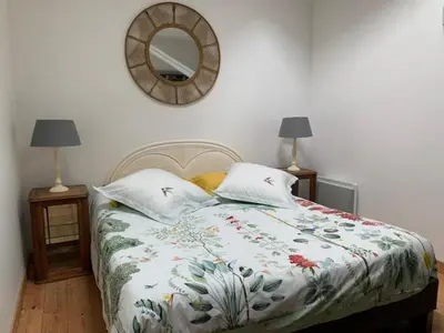 Un ou plusieurs lits dans un hébergement de l'établissement Gite du Logis de la Roche - Niort - Chauray