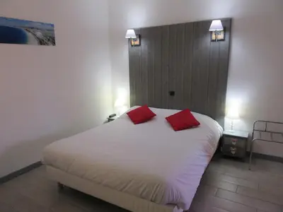 Un ou plusieurs lits dans un hébergement de l'établissement Hotel de France