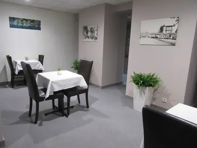 Coin salon dans l'établissement Hotel de France