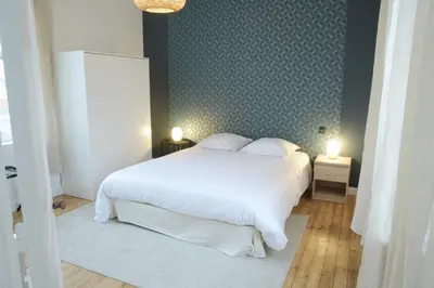 Un ou plusieurs lits dans un hébergement de l'établissement T2 de 55m2 avec toit terrasse, hyper centre, wifi, draps, savons et serviettes fournis