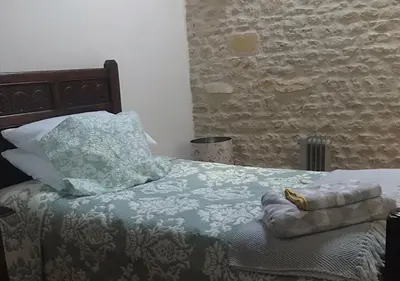 Un ou plusieurs lits dans un hébergement de l'établissement Le Figuier - 4 bedroom Farmhouse Gite