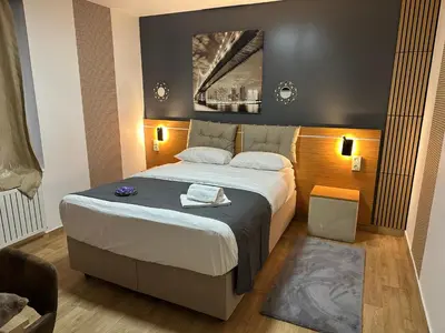 Un ou plusieurs lits dans un hébergement de l'établissement Hôtel Le Prince, Poitiers Gare