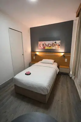 Un ou plusieurs lits dans un hébergement de l'établissement Hôtel Le Prince, Poitiers Gare