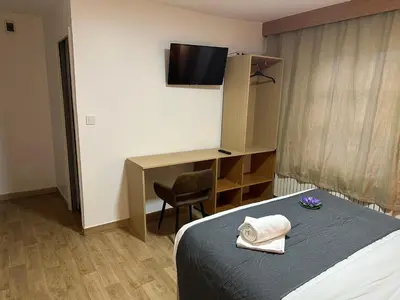 Un ou plusieurs lits dans un hébergement de l'établissement Hôtel Le Prince, Poitiers Gare