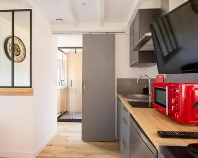 Cuisine ou kitchenette dans l'établissement Appartement T2- Le bon accueil / WIFI / PARKING