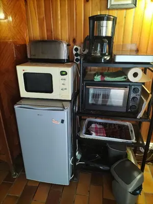 Cuisine ou kitchenette dans l'établissement Chambre de caractere