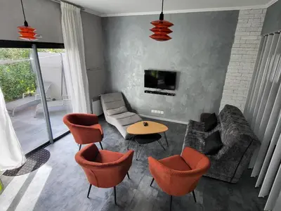Télévision ou salle de divertissement dans l'établissement EMLAVIE - Maison familiale OU Loft SPA - à 3km Futuroscope
