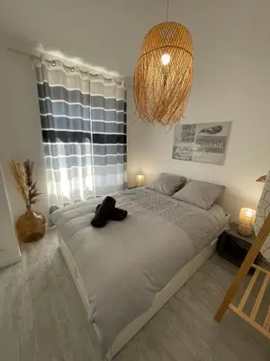 Un ou plusieurs lits dans un hébergement de l'établissement Le Bohème - Centre Ville, Netflix et WIFI, parking, idéal familles, couples et voyages d'affaire